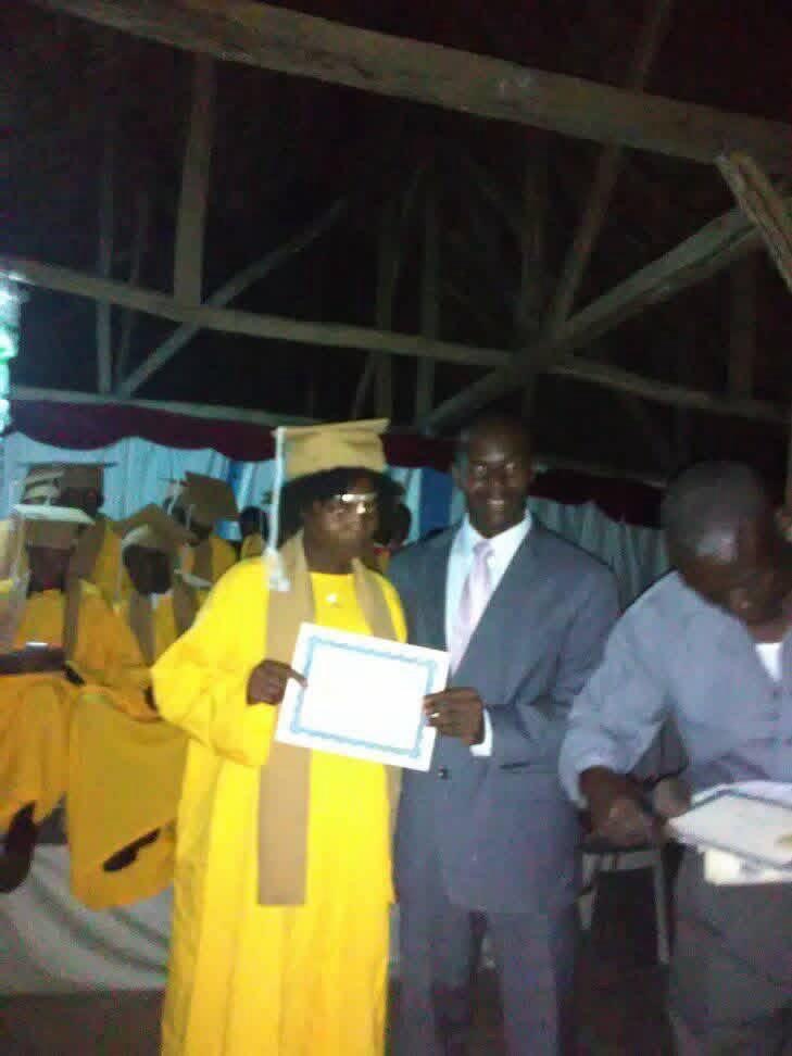 Graduate receiving her diploma on stage