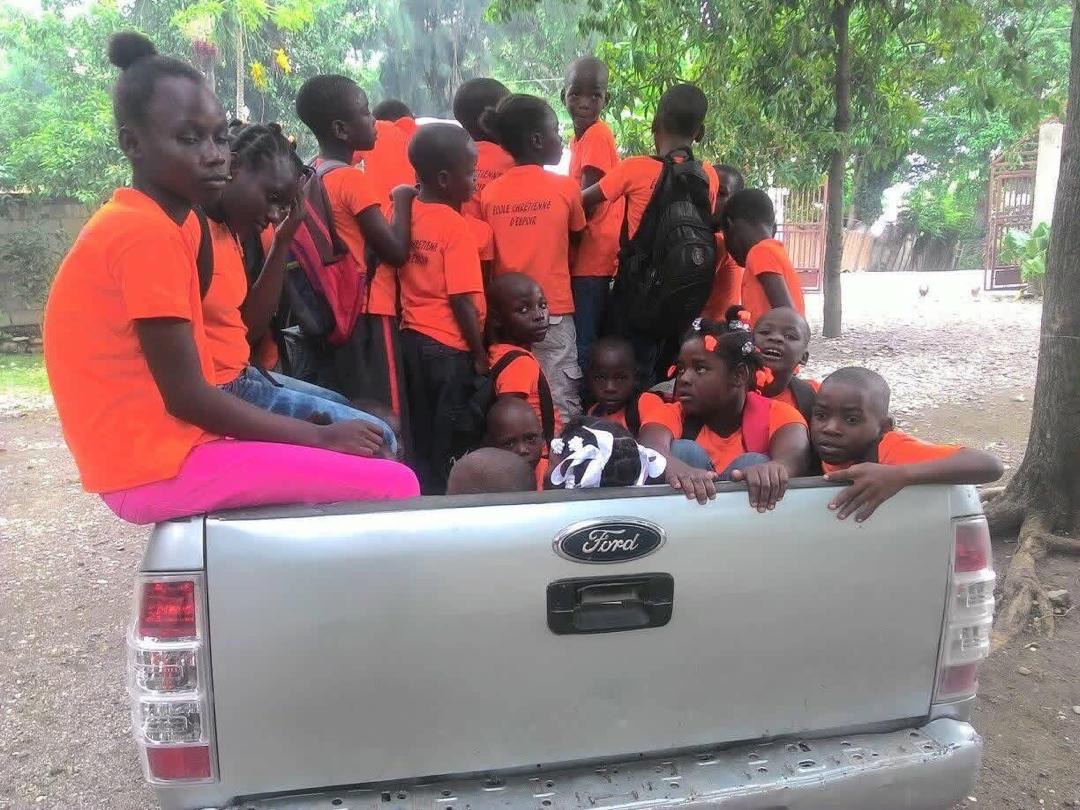 Students riding together in the school truck