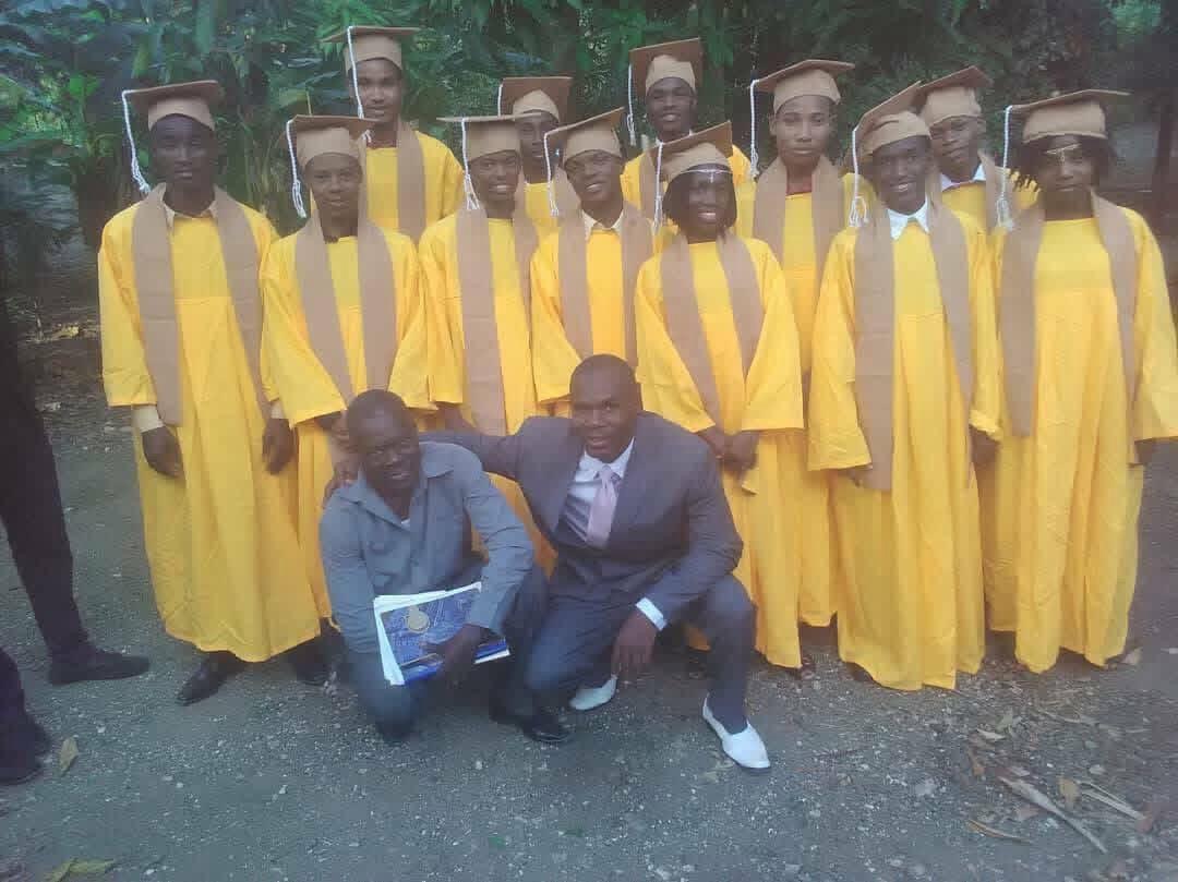 Graduating class in yellow gowns and caps